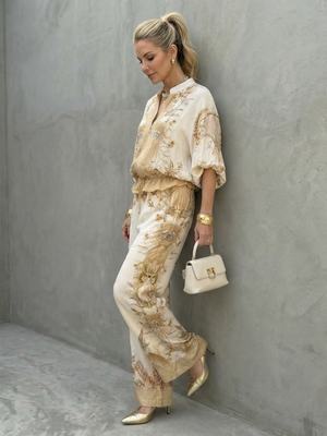 ORNELLA - Completo bianco due pezzi con blusa zip e pantaloni stampati