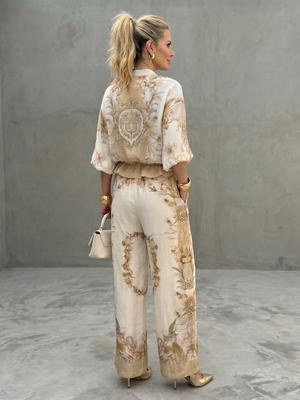 ORNELLA - Completo bianco due pezzi con blusa zip e pantaloni stampati