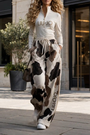 LIUJO Coordinato • Tessuto morbido • Stampa animalier effetto mucca e zip frontale — Fermina — SHOT 2